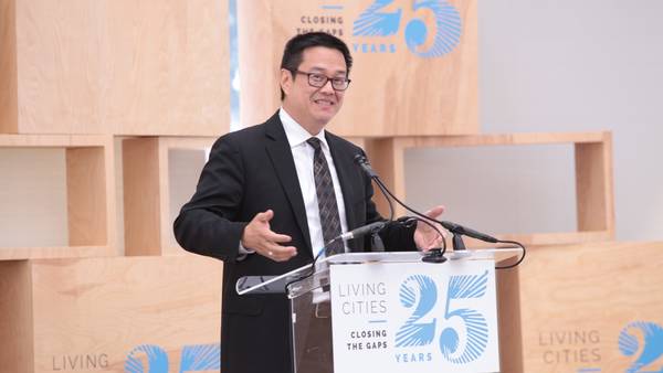 Don Chen speaks at a podium at LC's 25th Anniversary.